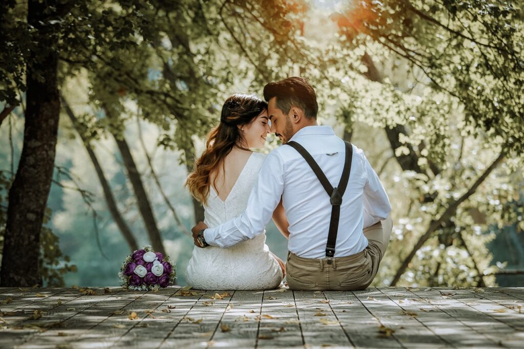 Just married couple sitting on a deck