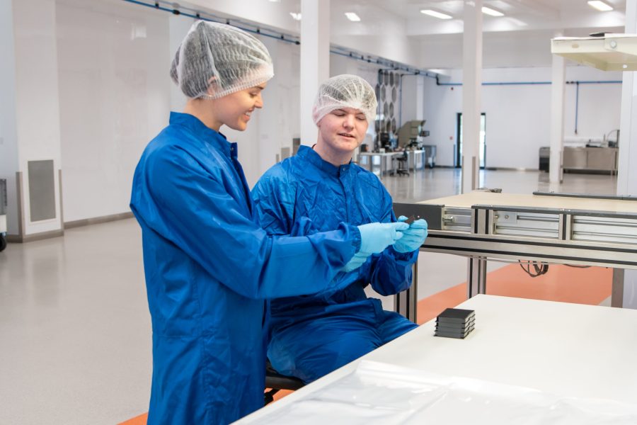 Staff in lab coats during a corporate site event