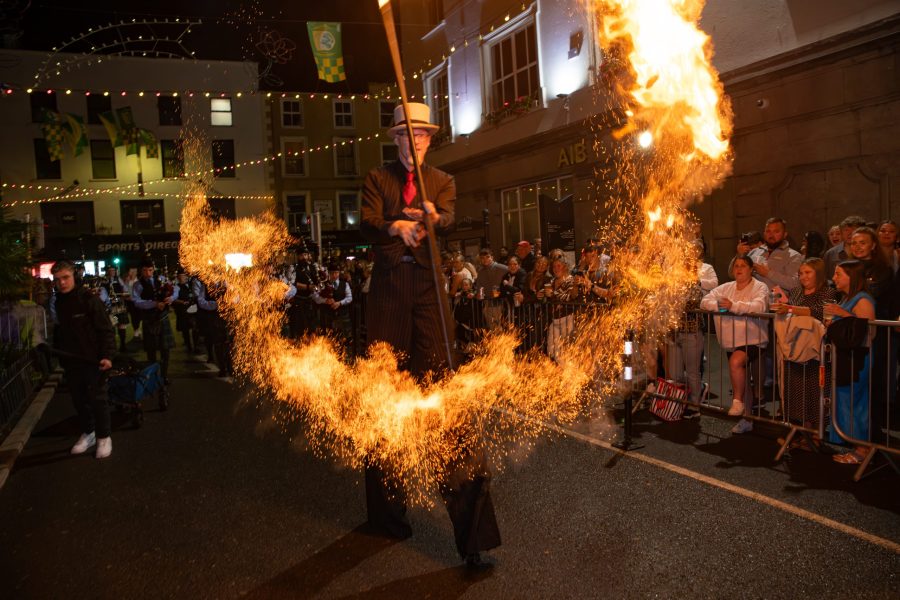 Fire performer at a night-time street festival